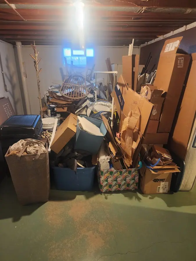 Roll-off dumpster container at job site for Roll Off Dumpster Rental in Glen Cove